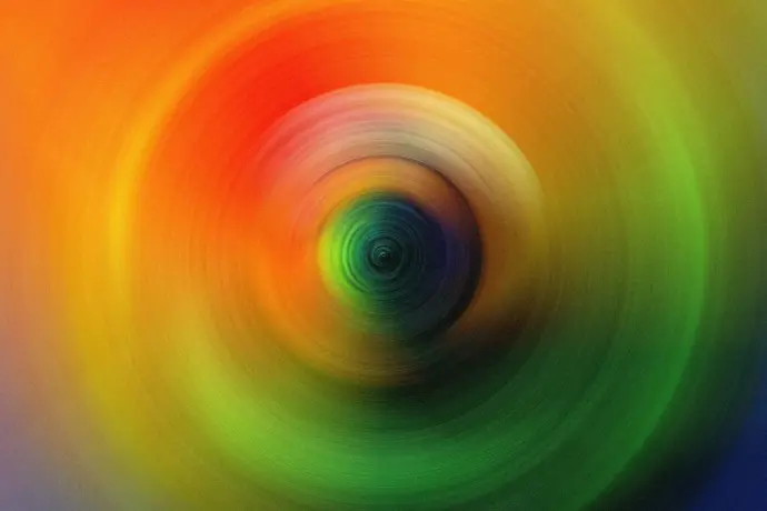 a close up of a green and orange circle